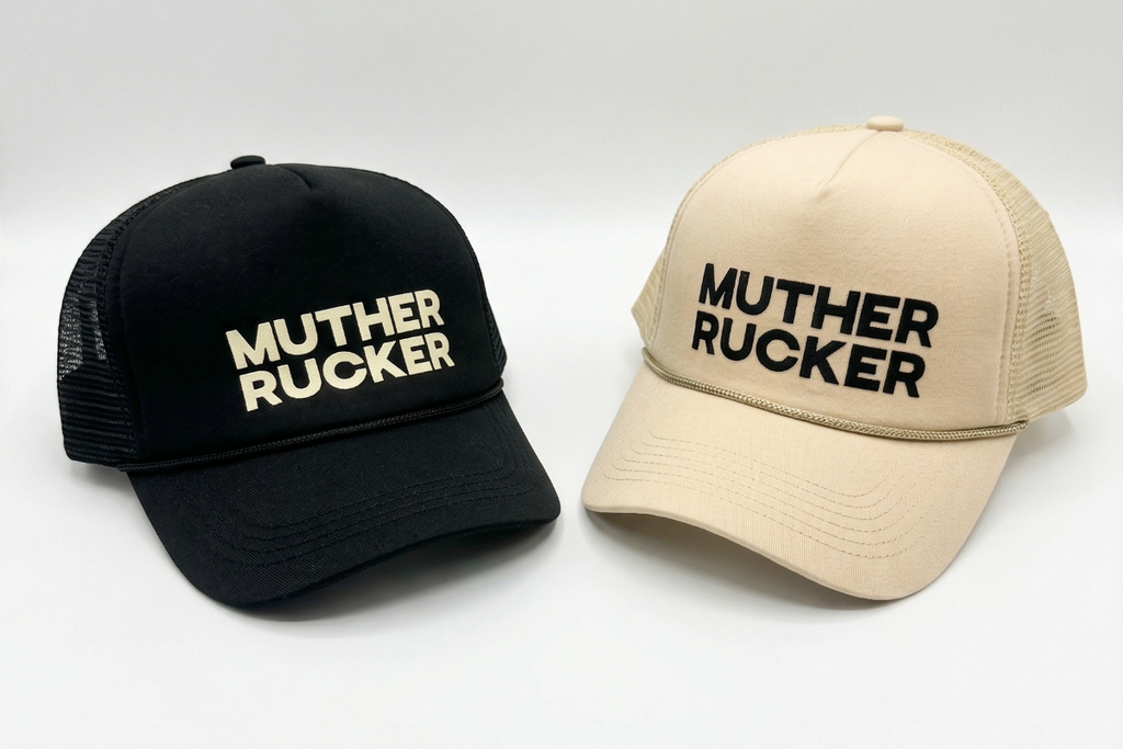 Two caps, one black and one beige, with 'Muther Rucker' text on a white background